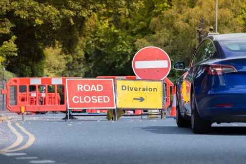 Road closed and diversion signs at a street works site