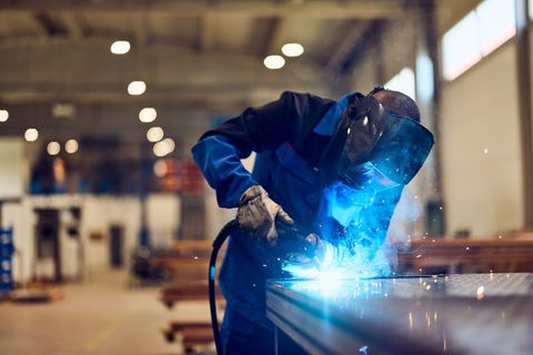 A welder at work in a fabrication shop